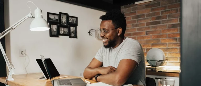 Man-Looking-At-Laptop-1280x547