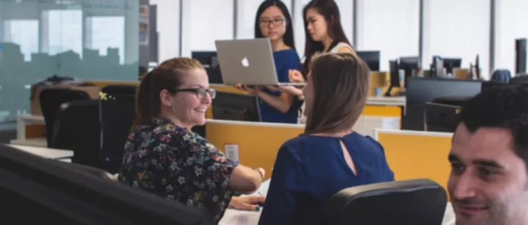 office-workers-talking-smiling-6-1-1280x547